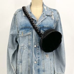 TASHA TARNO Real merino and lamb leather fanny pack on a chain.